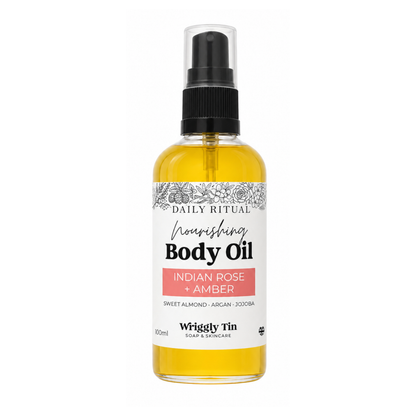 Indian Rose and Amber Natural Body oil bottle with label on a white background